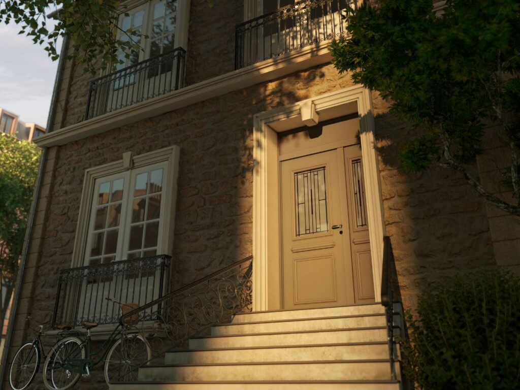 une entrée de maison de ville avec un escalier menant vers la porte d'entrée classique