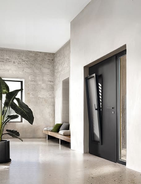 porte d'entrée aluminium contemporaine avec fenetre dans l'ouvrant et moustiquaire de porte d'entrée dans un intérieur minimaliste et épuré